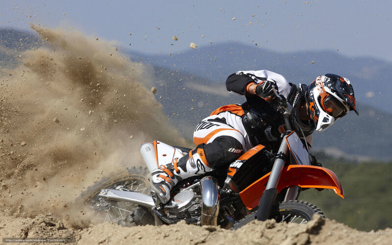 Motocross rider on dirt track