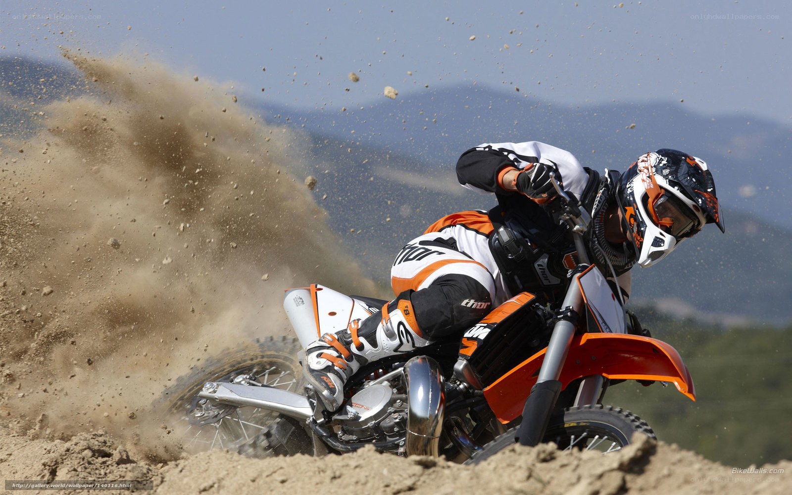 Motocross rider on dirt track