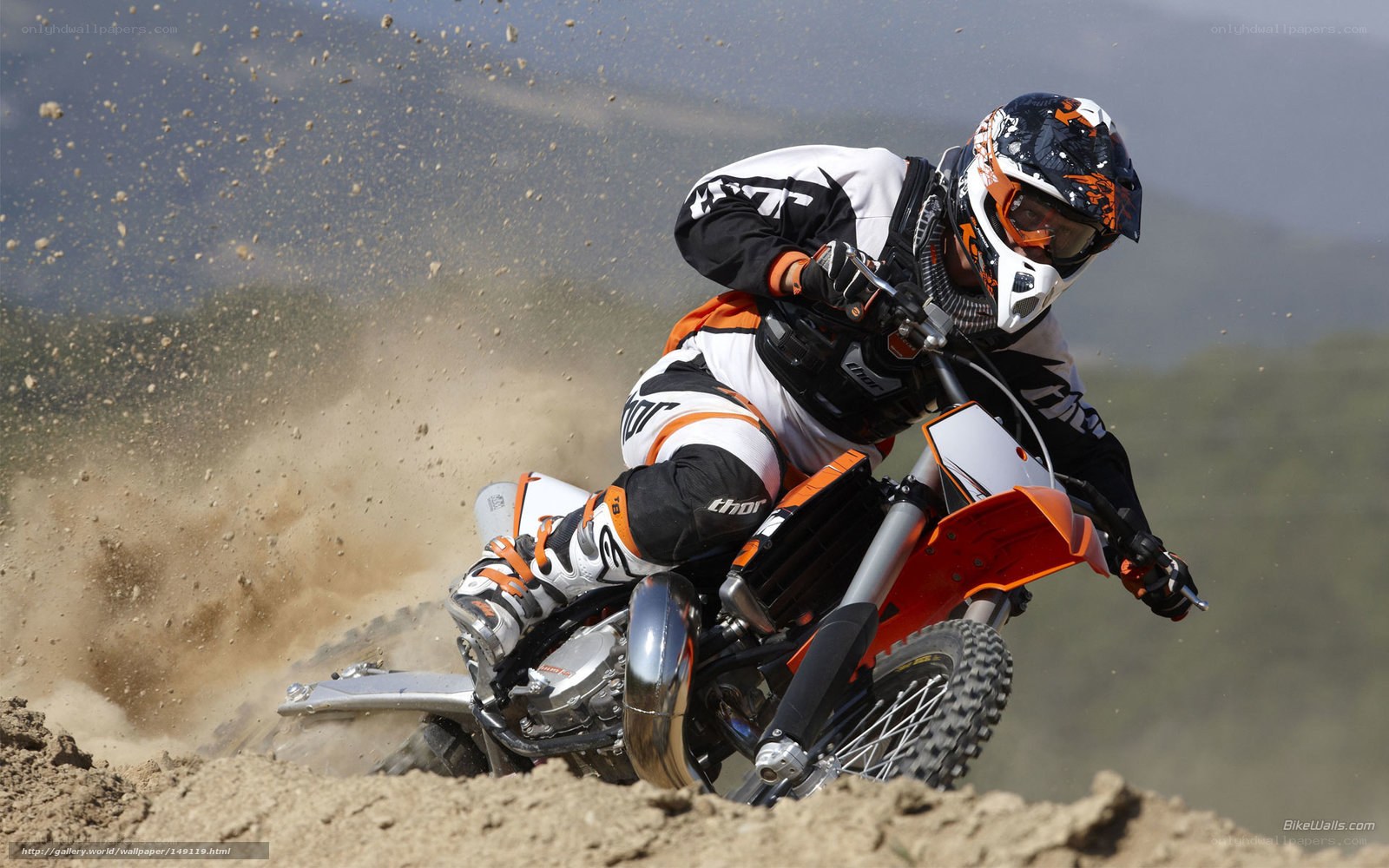 Motocross rider on dirt track