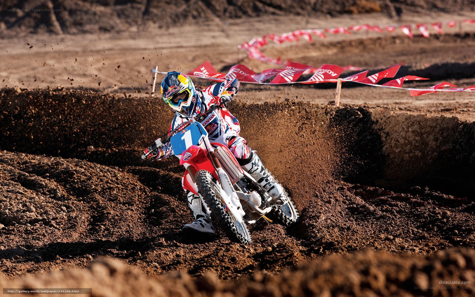 Motocross rider on dirt track