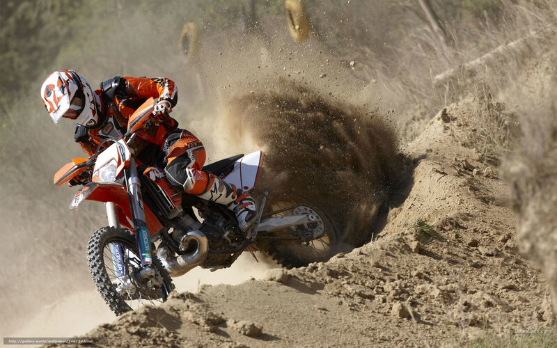 Motocross rider on dirt track