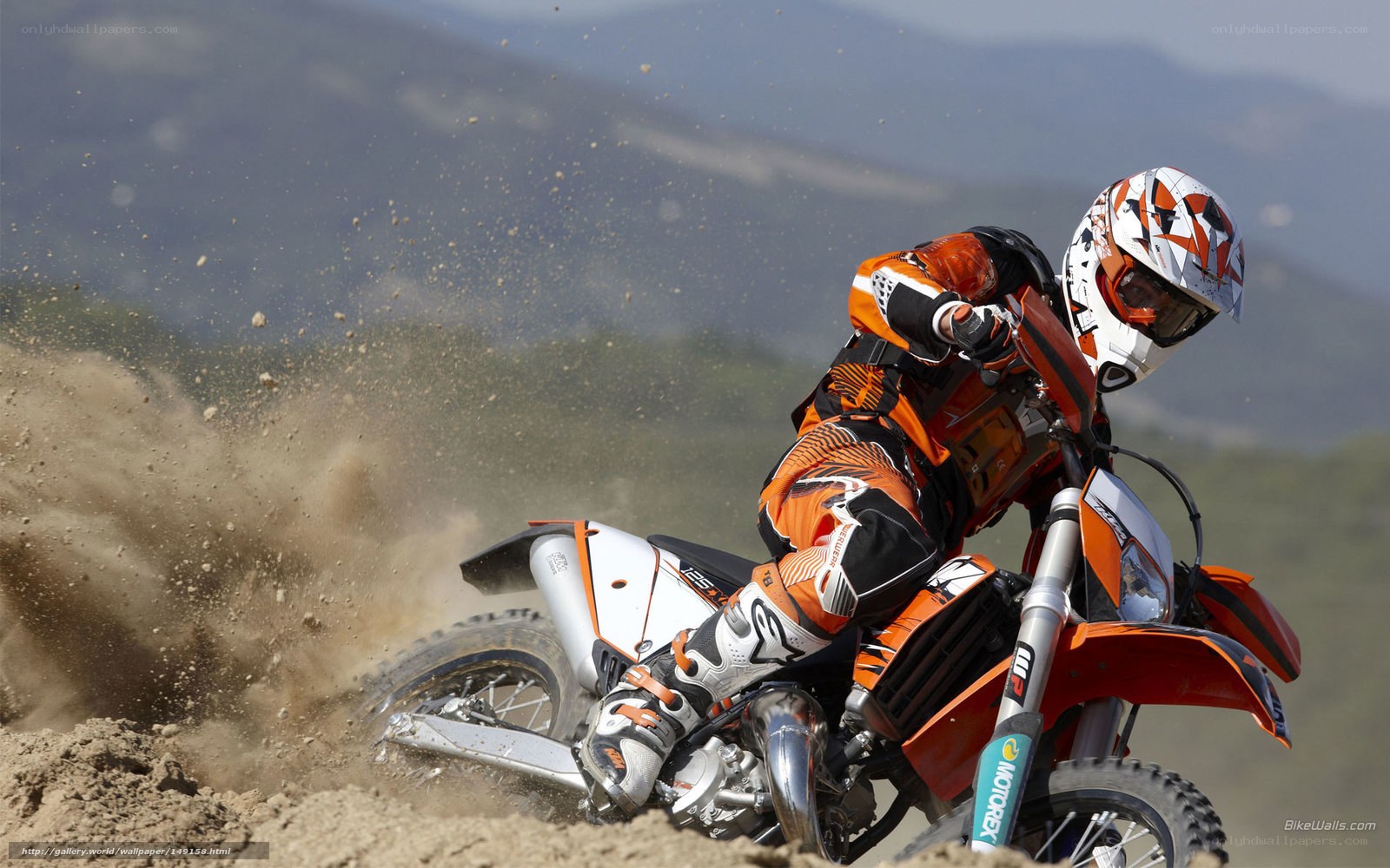 Motocross rider on dirt track