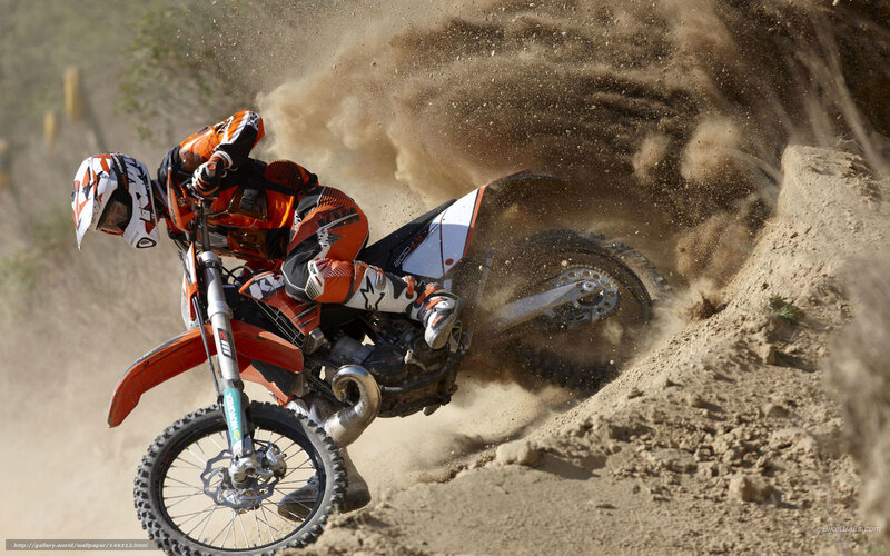 Motocross rider on dirt track