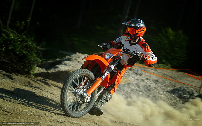 Motocross rider on dirt track
