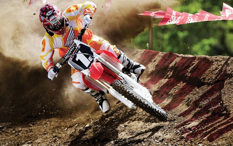 Motocross rider on dirt track