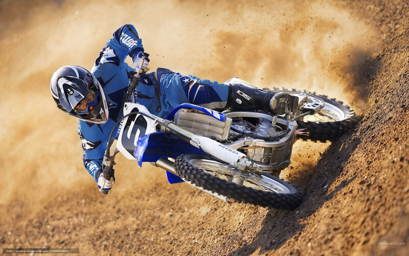 Motocross rider on dirt track