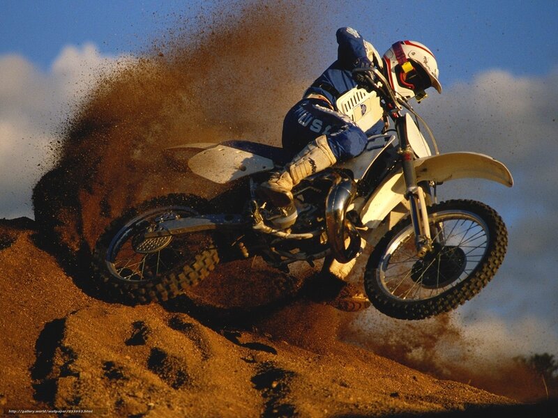 Motocross rider on dirt track