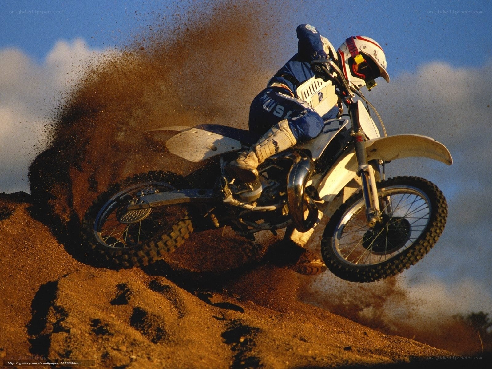 Motocross rider on dirt track