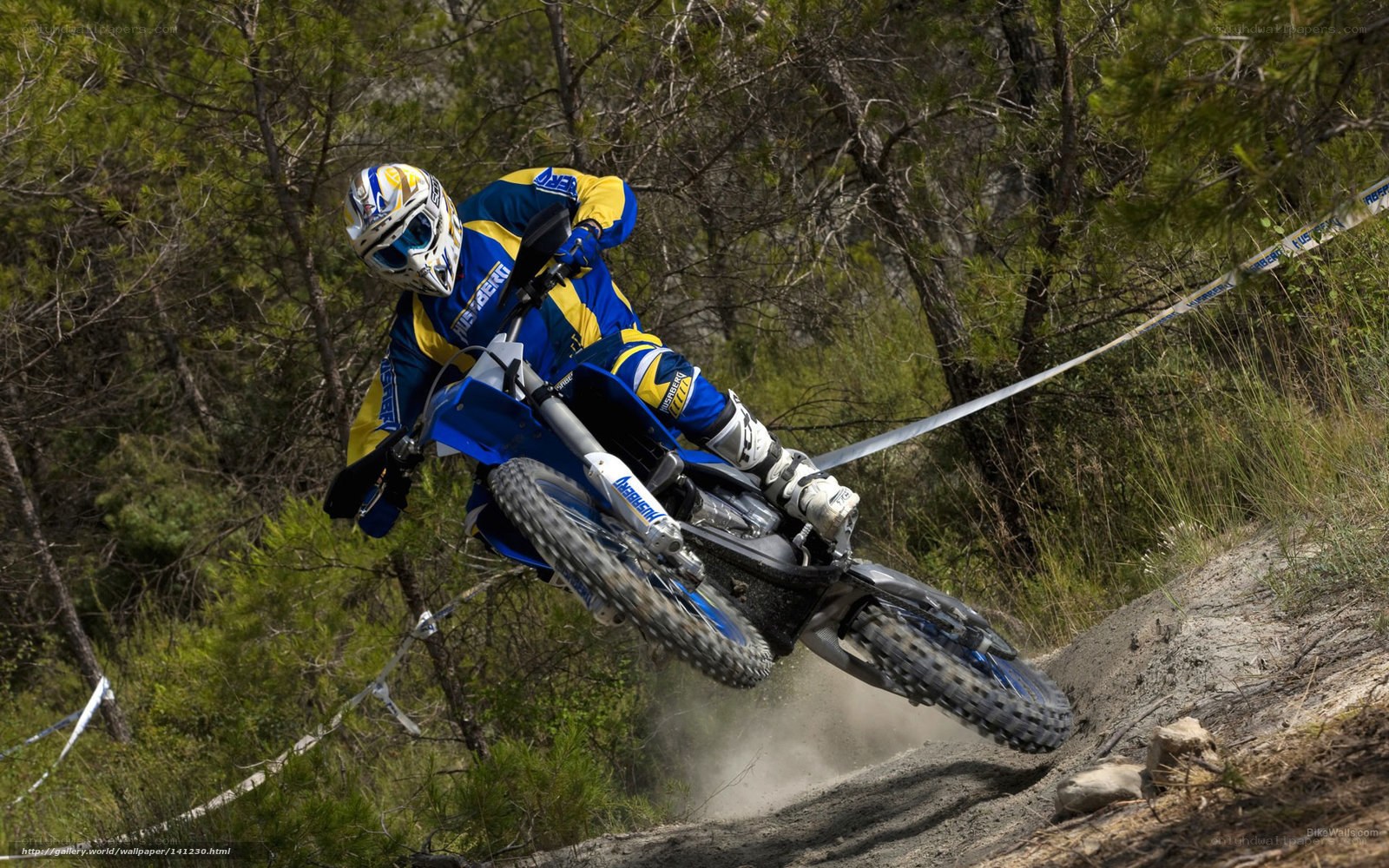 Motocross rider on dirt track