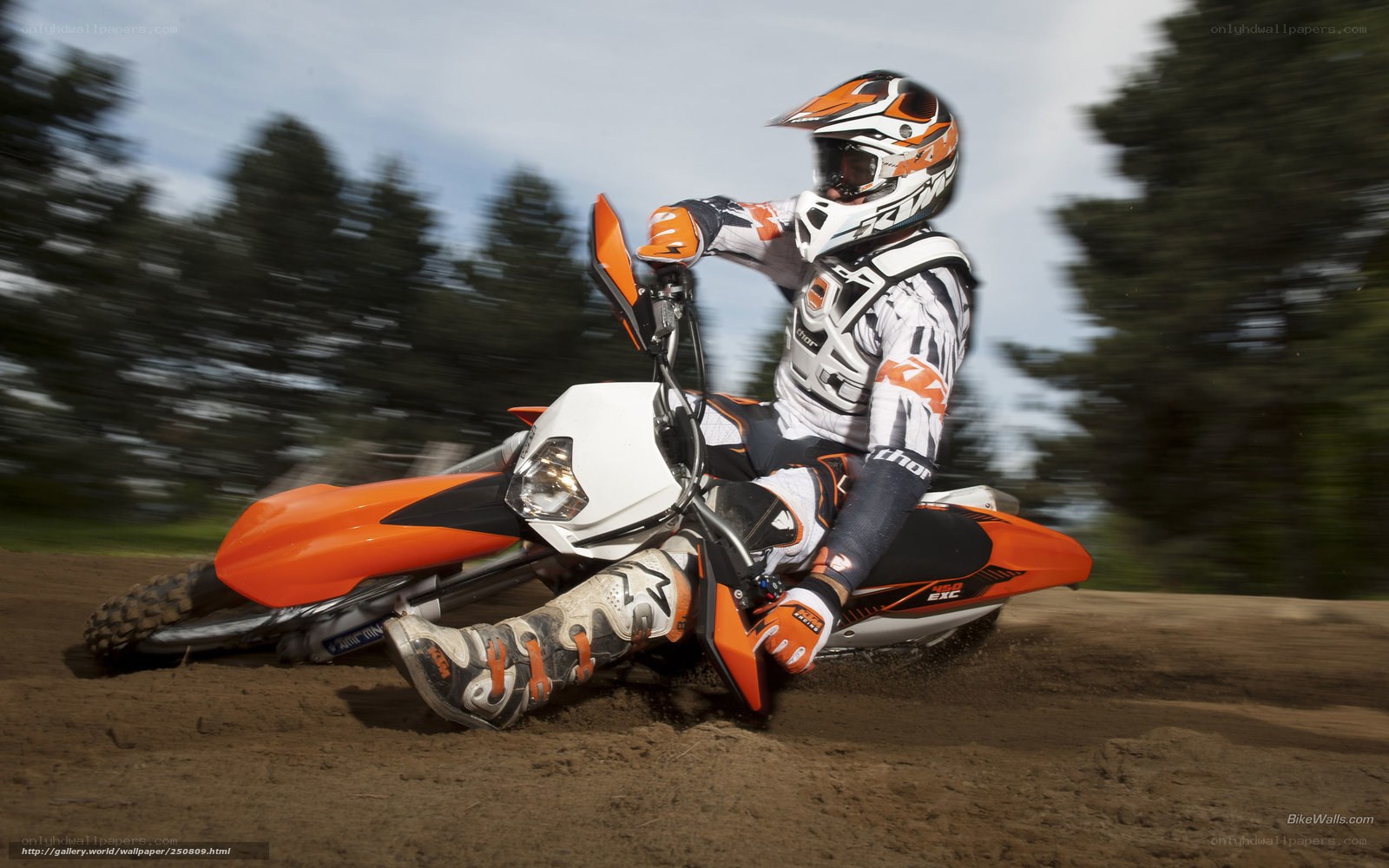 Motocross rider on dirt track