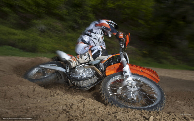 Motocross rider on dirt track