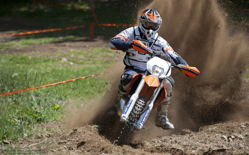 Motocross rider on dirt track