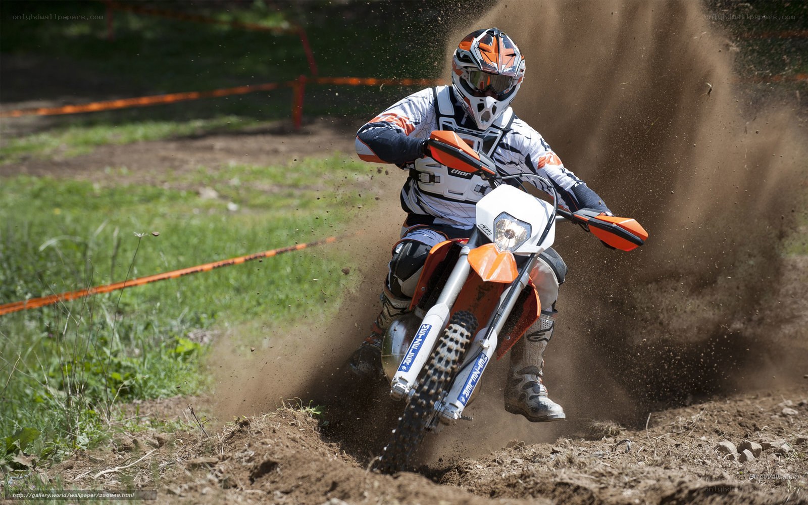 Motocross rider on dirt track