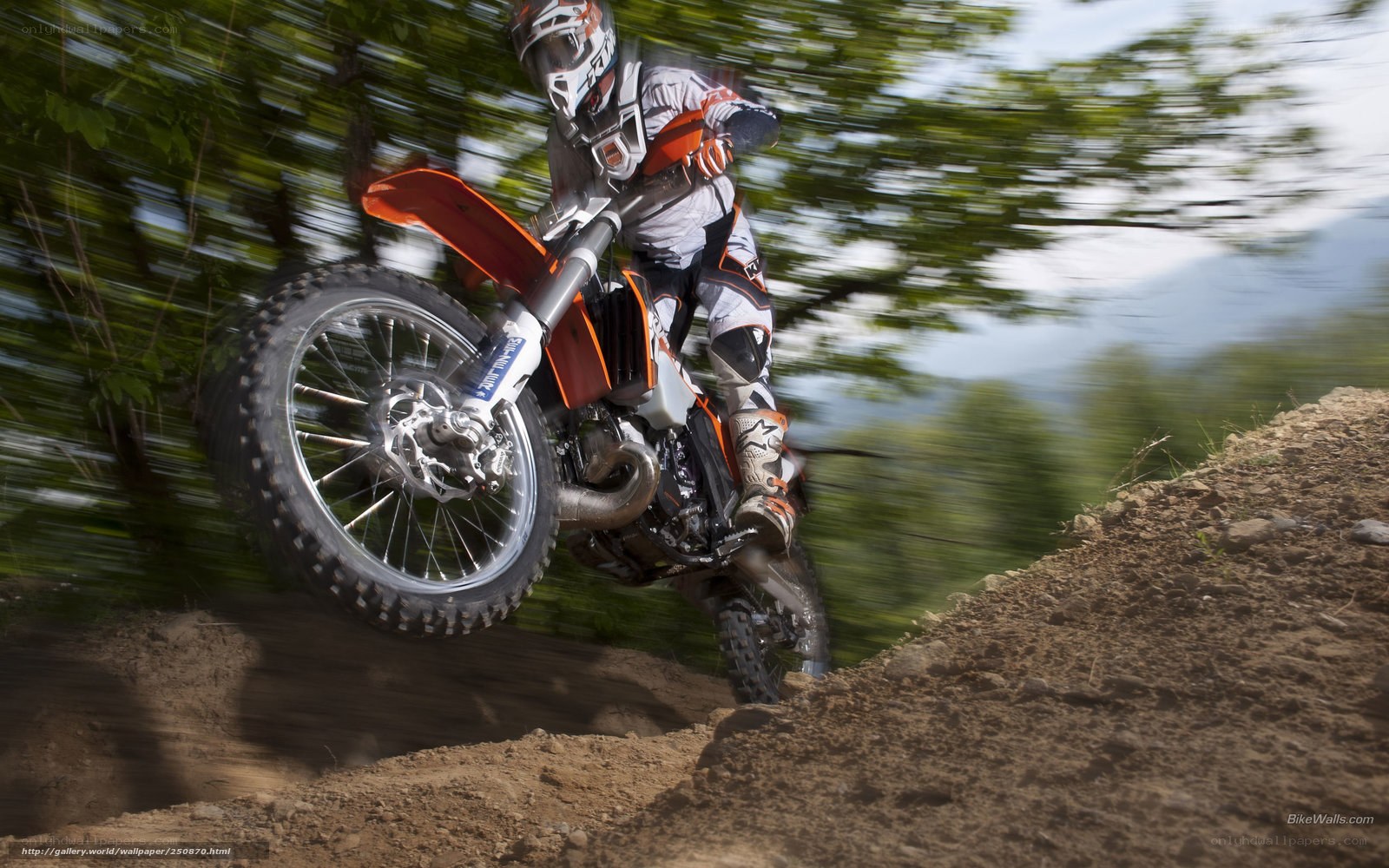 Motocross rider on dirt track