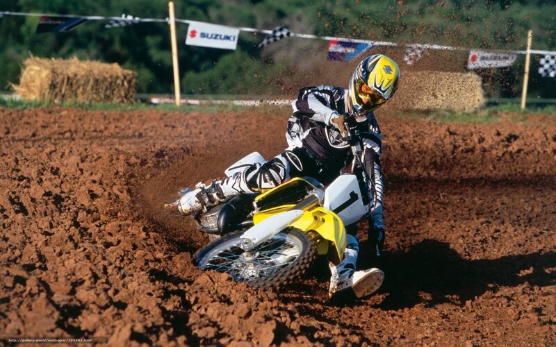 Motocross rider on dirt track