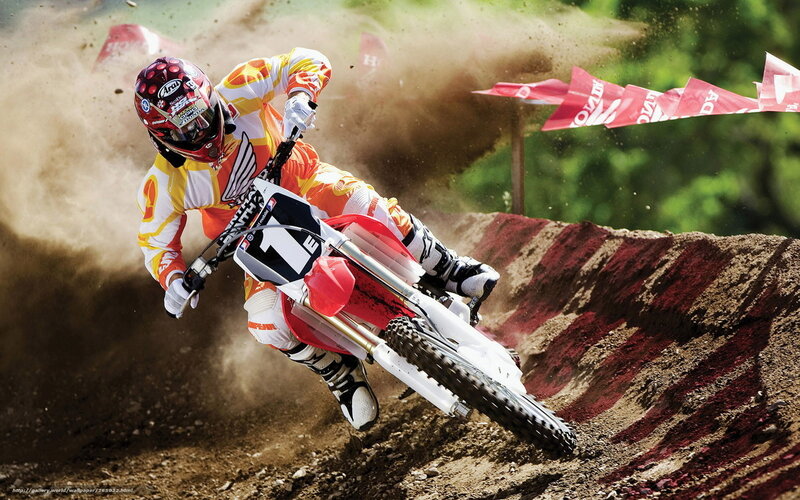 Motocross rider on dirt track