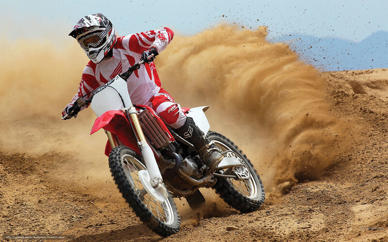 Motocross rider on dirt track