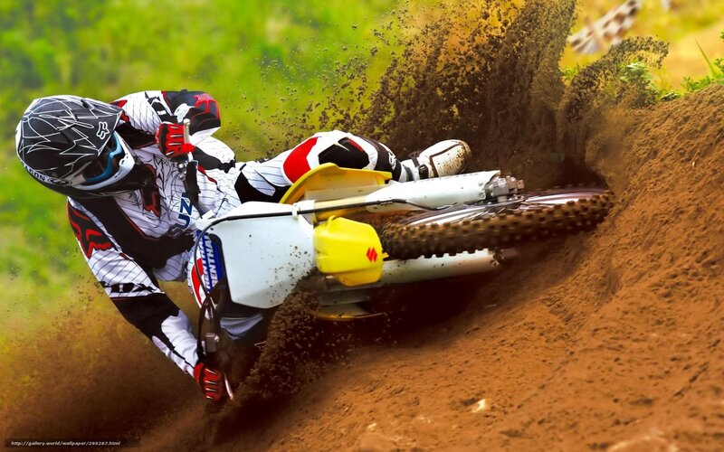 Motocross rider on dirt track