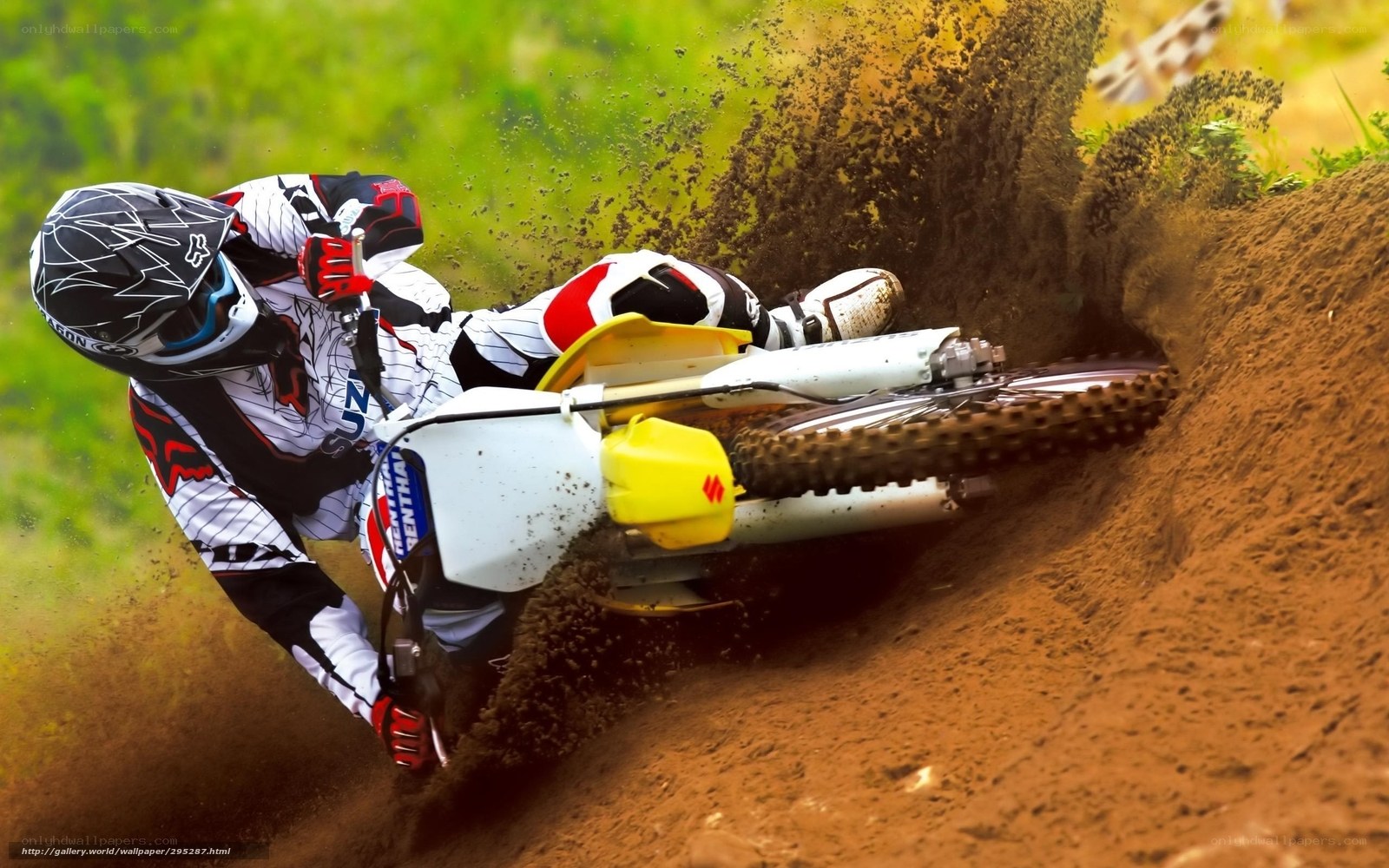 Motocross rider on dirt track
