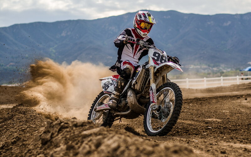 Motocross rider on dirt track