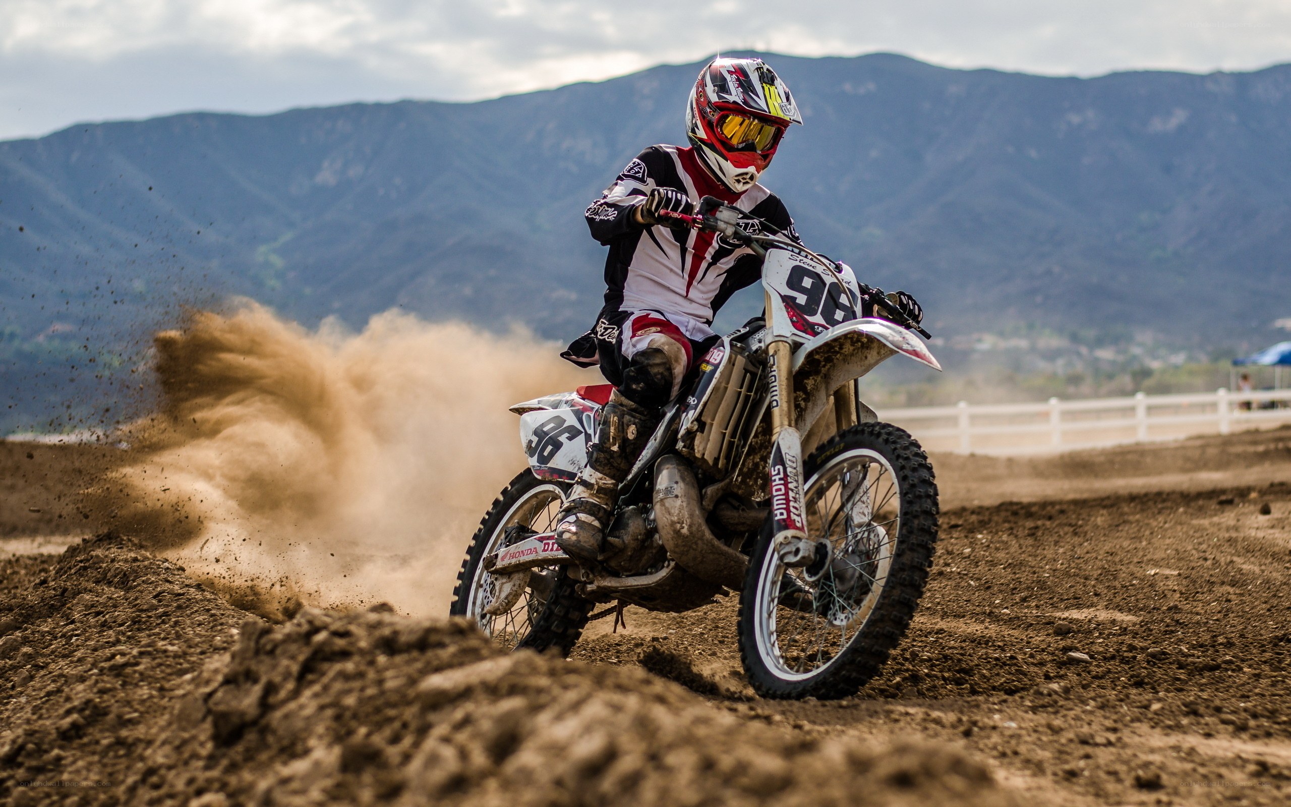 Motocross rider on dirt track