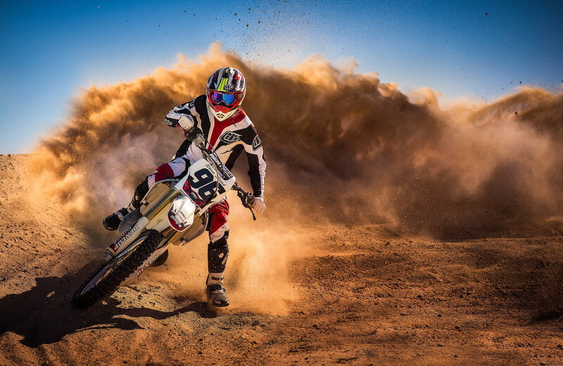 Motocross rider on dirt track