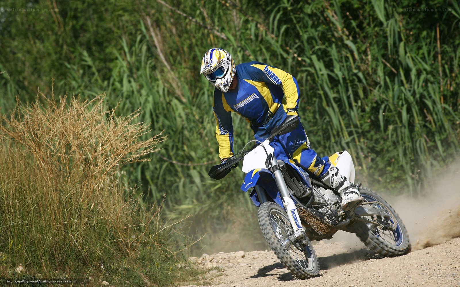 Motocross rider on dirt track