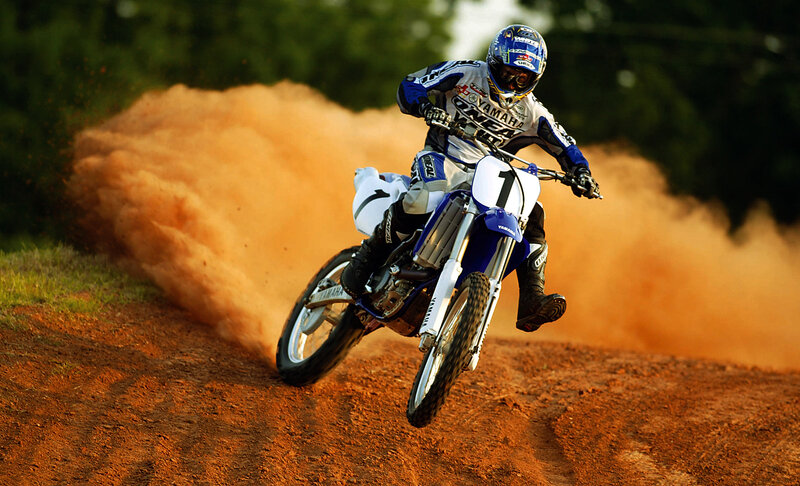 Motocross rider on dirt track