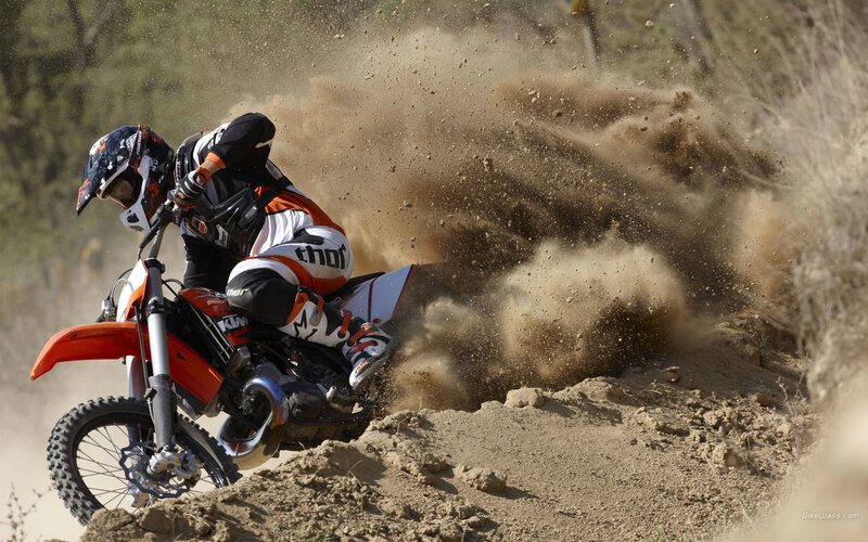 Motocross rider on dirt track