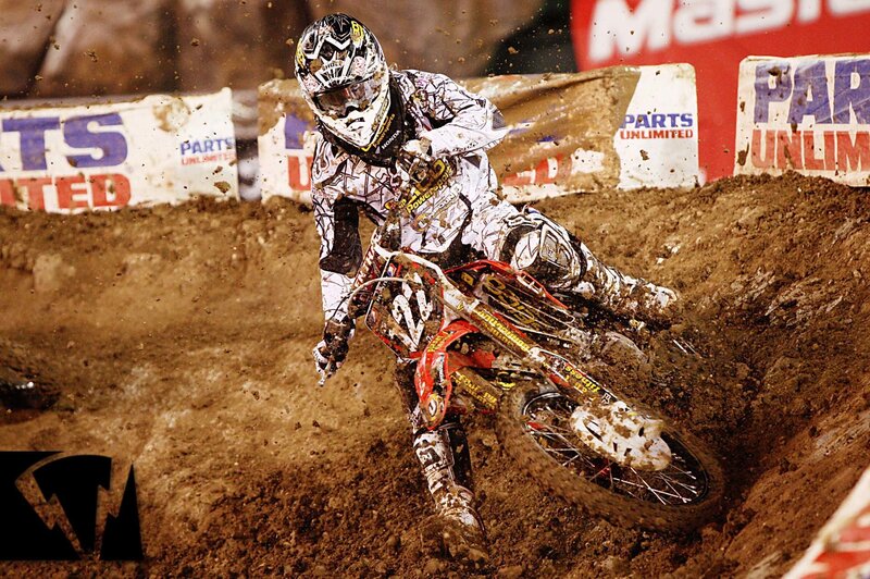 Motocross rider on dirt track