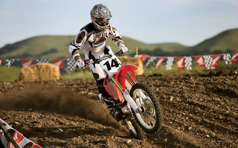 Motocross rider on dirt track