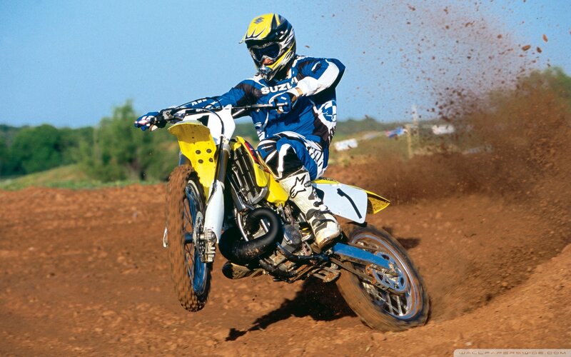 Motocross rider on dirt track