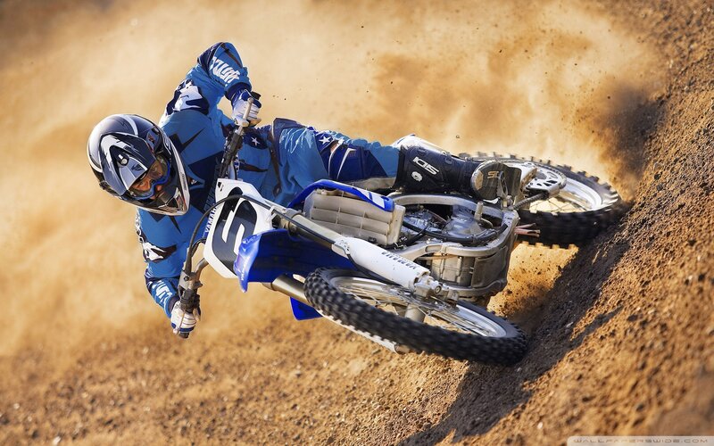 Motocross rider on dirt track