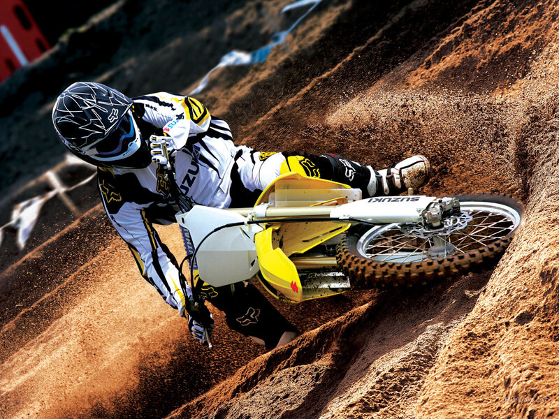 Motocross rider on dirt track