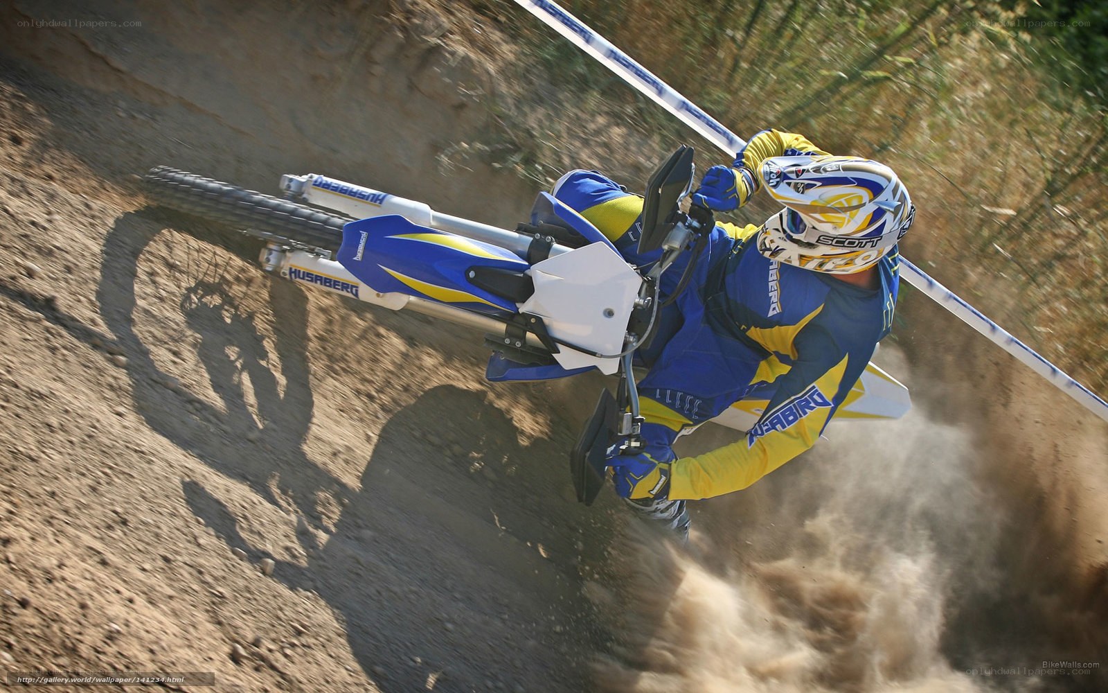 Motocross rider on dirt track