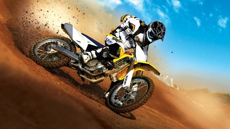 Motocross rider on dirt track