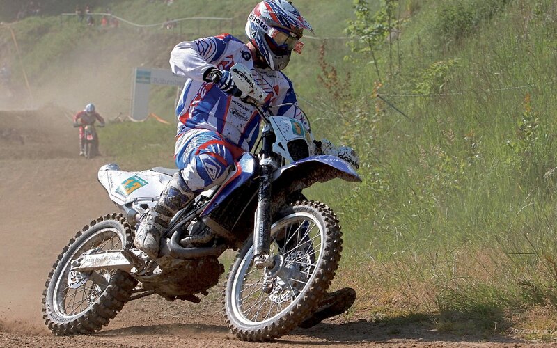 Motocross rider on dirt track