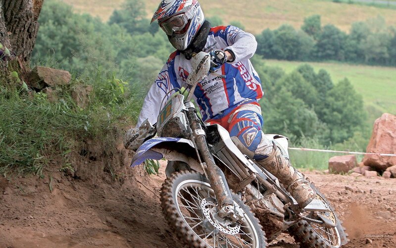 Motocross rider on dirt track