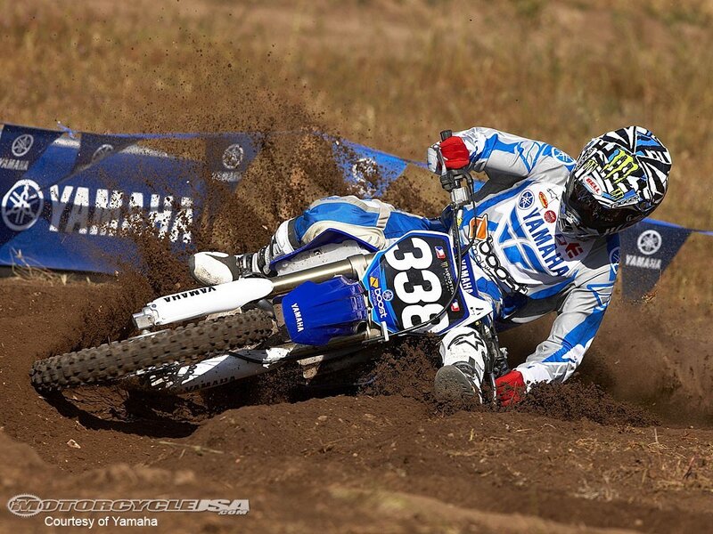 Motocross rider on dirt track