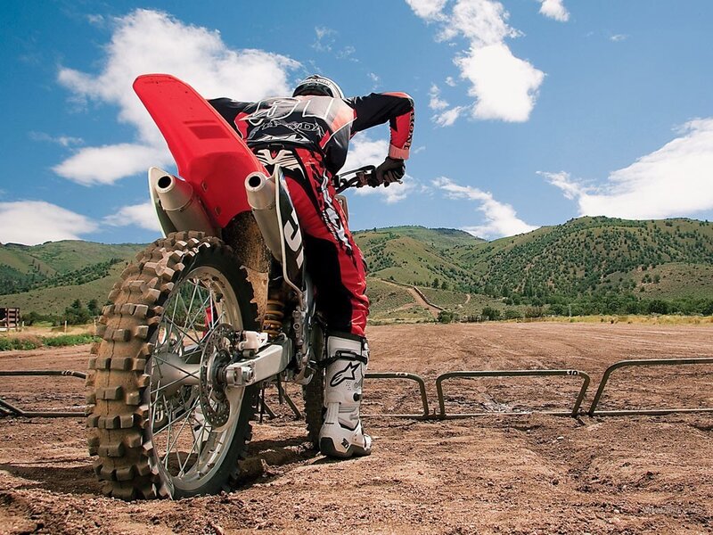 Motocross rider on dirt track