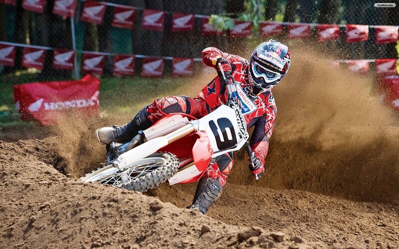 Motocross rider on dirt track