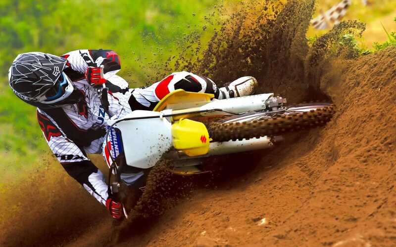 Motocross rider on dirt track