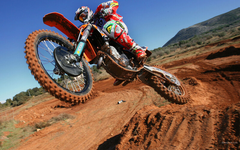 Motocross rider on dirt track
