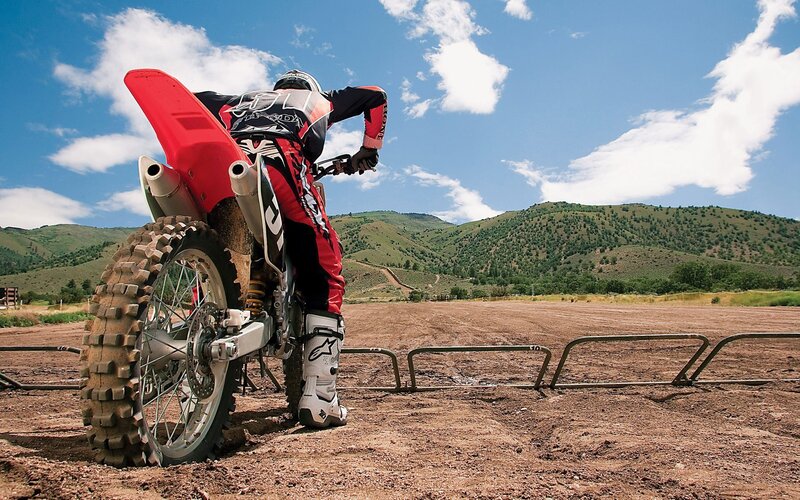 Motocross rider on dirt track