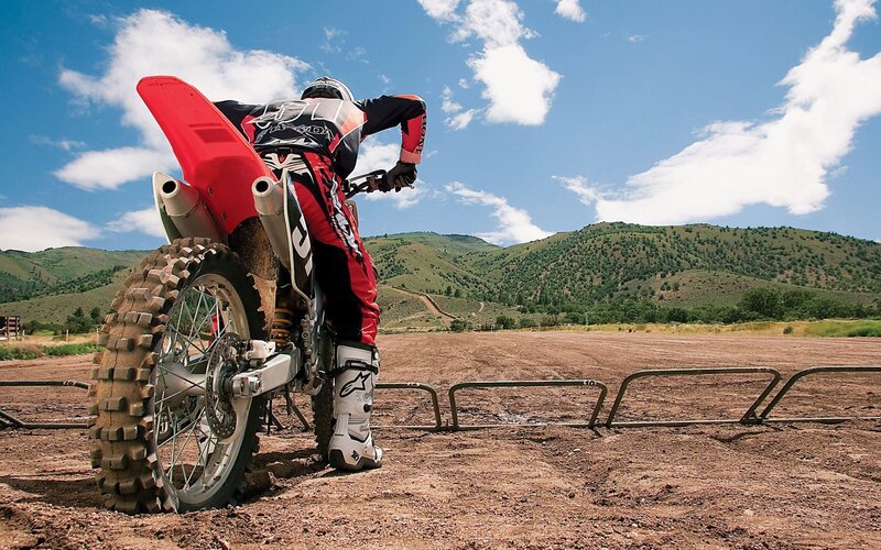 Motocross rider on dirt track