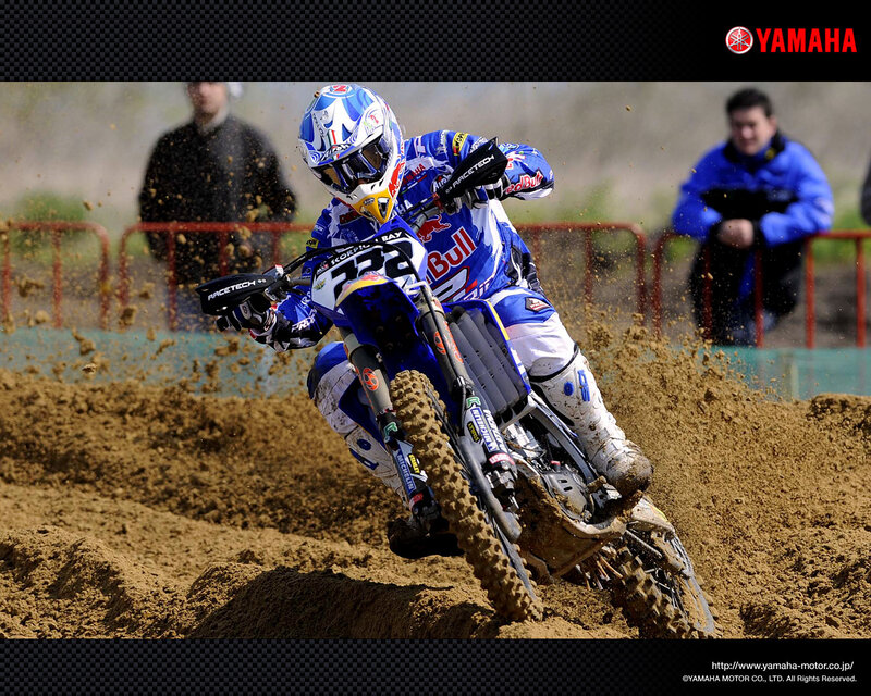 Motocross rider on dirt track