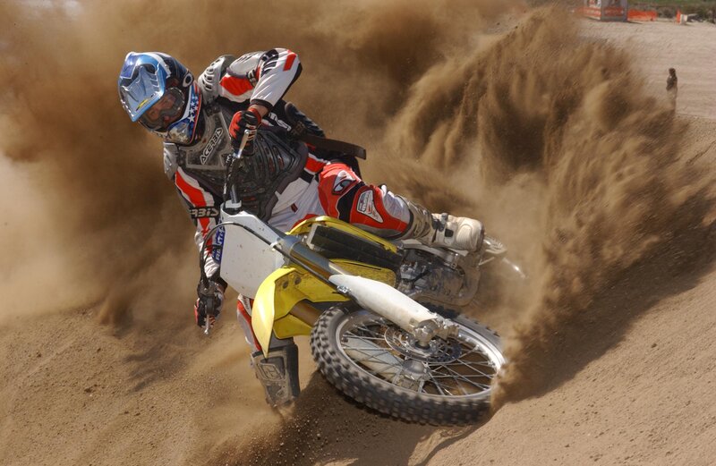 Motocross rider on dirt track
