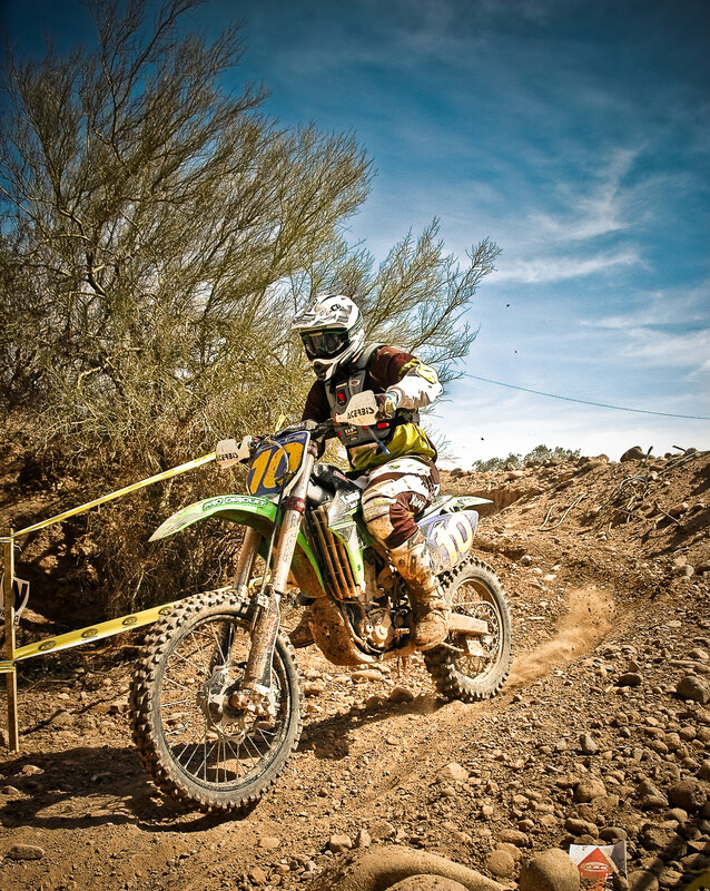 Motocross rider on dirt track