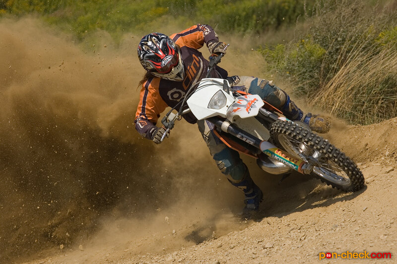 Motocross rider on dirt track