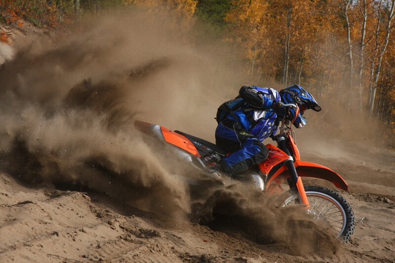 Motocross rider on dirt track